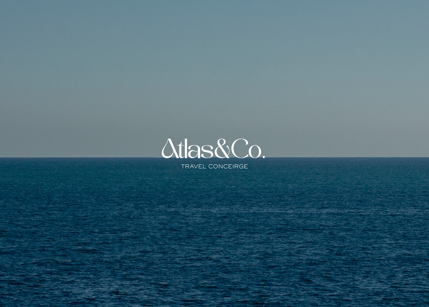 Luxury travel concierge logo placed over a calm ocean horizon, reinforcing clarity, trust and long-term brand positioning.