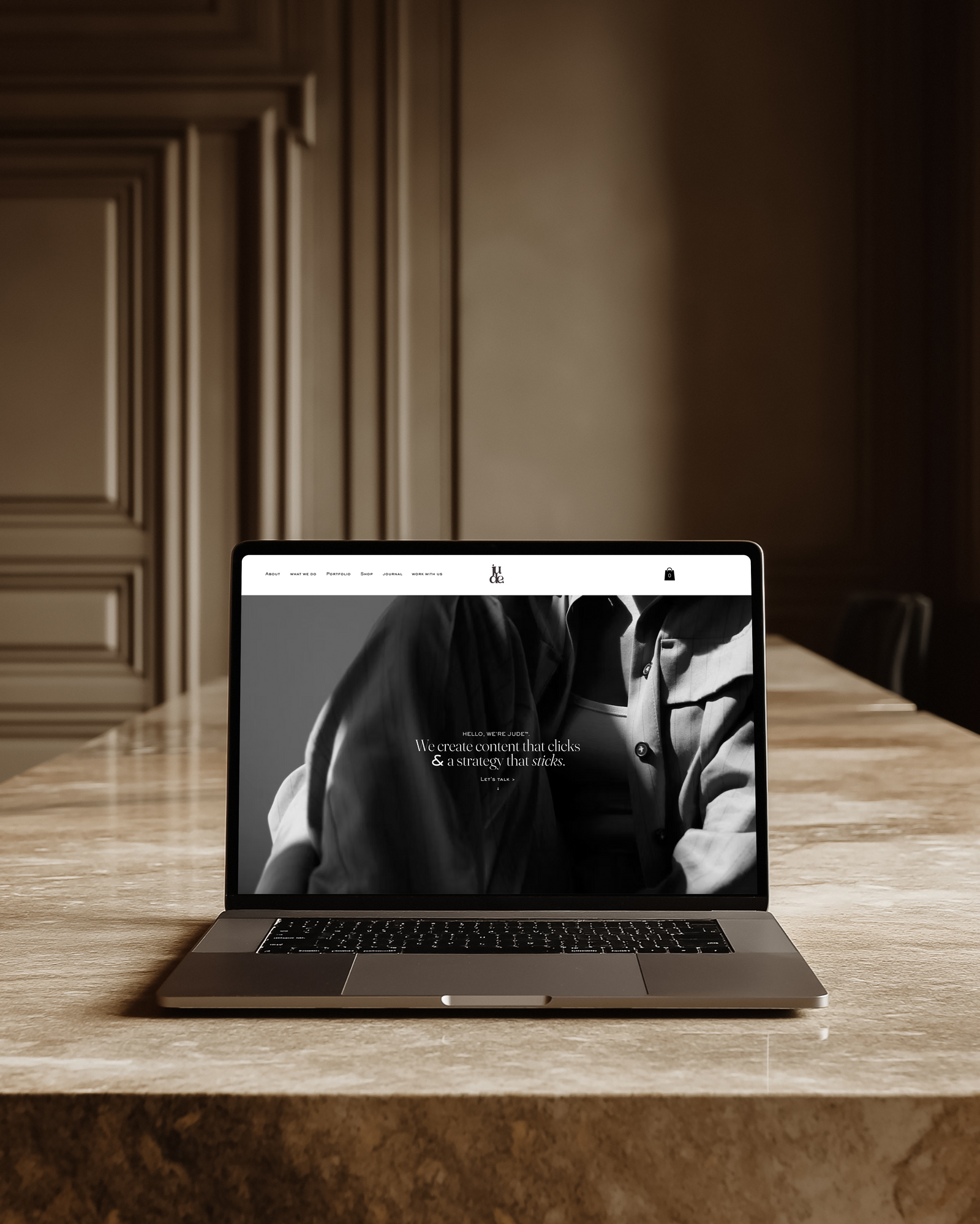 A JUDE™ website on a laptop